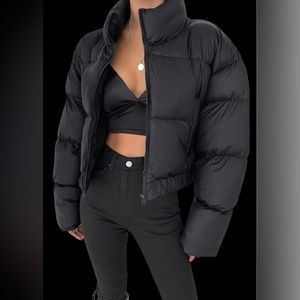 Black puffer jacket with front zipper